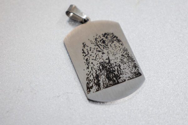 A smaller image of a laser-engraved print on a tag