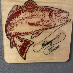 A fishing print engraved on a wooden plate