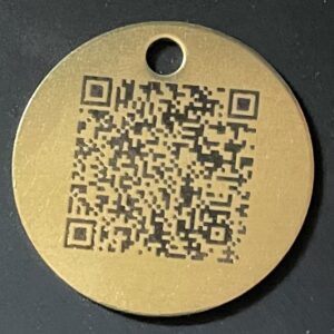 A QR code engraved on a pendant