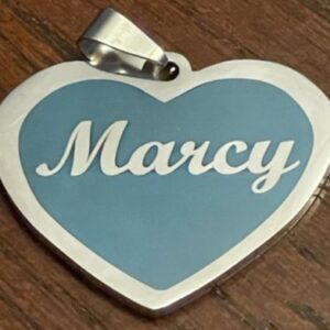 A Marcy text on a heart pendant