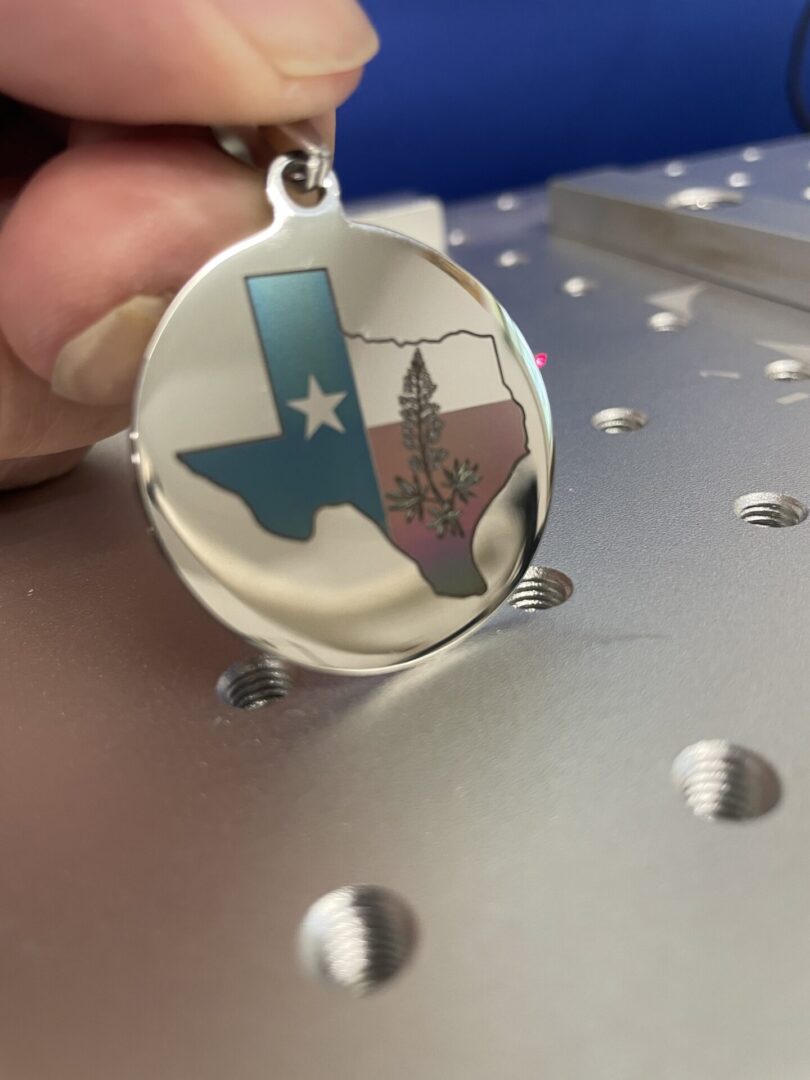Texas print engraved on a pendant