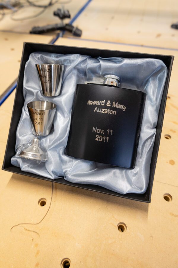 A smaller image of a liquor set with text engraved